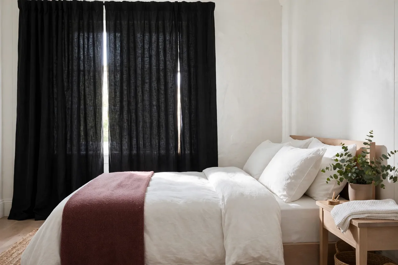 Blackout curtains fully closed in a cozy guest room